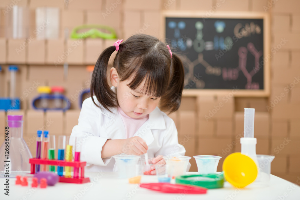 Young girl was doing science experiment at home Young girl was doing science experiment at home