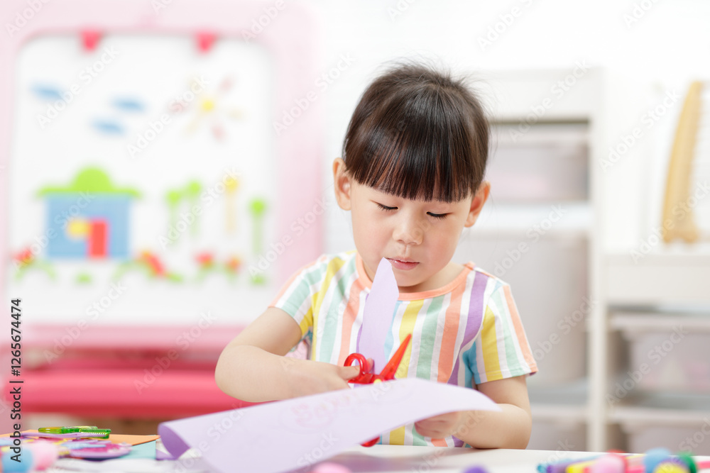 A young girl was creating a craft at home A young girl was creating a craft at home
