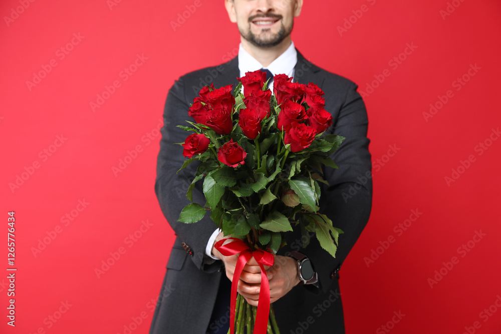Happy Valentine's Day. Man with bouquet of roses on red background, closeup Happy Valentine's Day. Man with bouquet of roses on red background, closeup