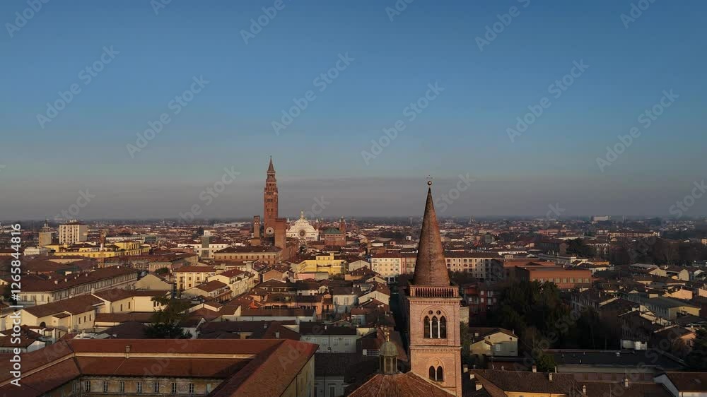 Drone orbiting around San Pietro al Po bell tower, Torrazzo and Cathedral in the background Drone orbiting around San Pietro al Po bell tower, Torrazzo and Cathedral in the background