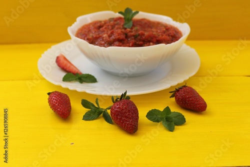Gazpacho is a classic Spanish tomato soup flavored with mint, garlic, spices, and herbs. A must-try!