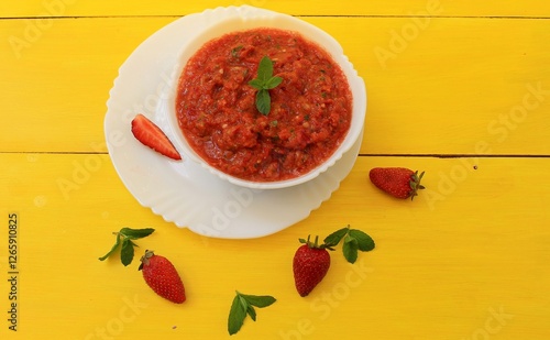 Gazpacho is a classic Spanish tomato soup flavored with mint, garlic, spices, and herbs. A must-try!
