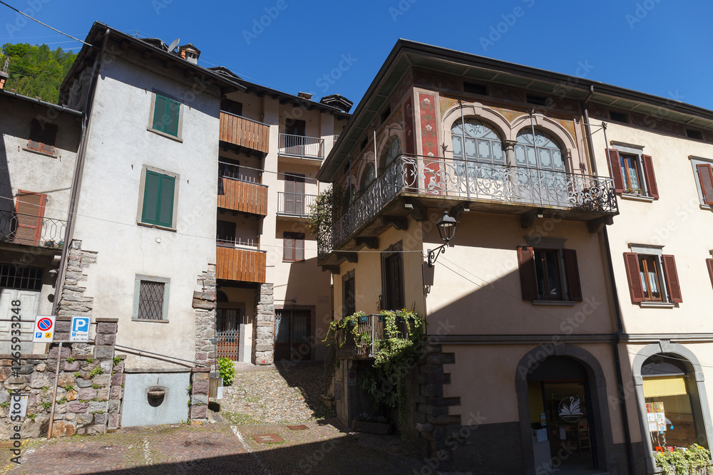 GROMO, ITALY - MAY 22, 2024: Street view of historical village with narrow cobbled streets, shot in bright summer light