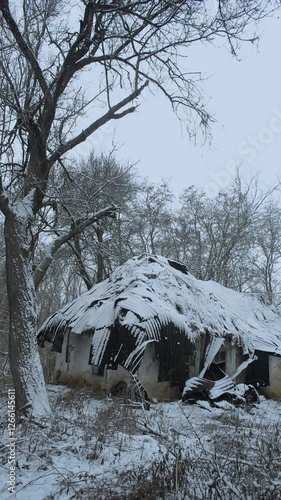Old abandoned house,winter video landscape, house with damaged, winter day in the woodlands with old cabin. Snow covered trees . Mysterious place 