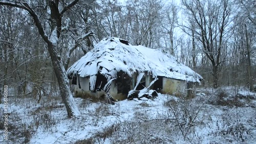 Old abandoned house,winter video landscape, house with damaged, winter day in the woodlands with old cabin. Snow covered trees . Mysterious place 
