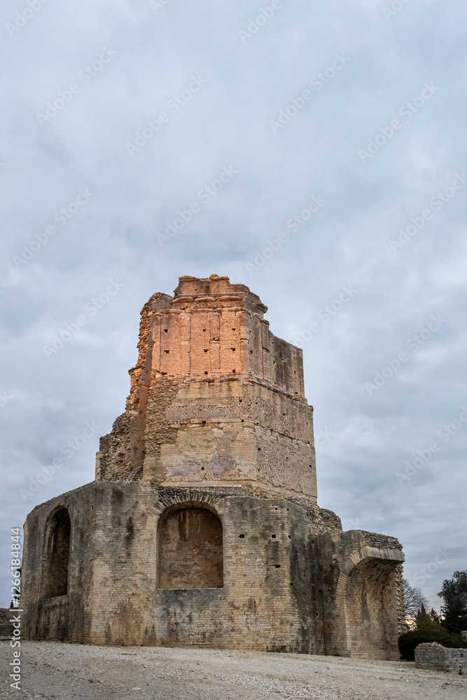 The Magne Tower in Nimes, a well preserved Roman tower situated in the park called Les Jardins de la Fontaine in Nîmes, Occitanie, France The Magne Tower in Nimes, a well preserved Roman tower situated in the park called Les Jardins de la Fontaine in Nîmes, Occitanie, France