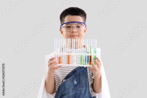 Cute little boy holding che...