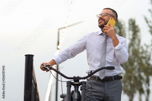 Young happy businessman wit...