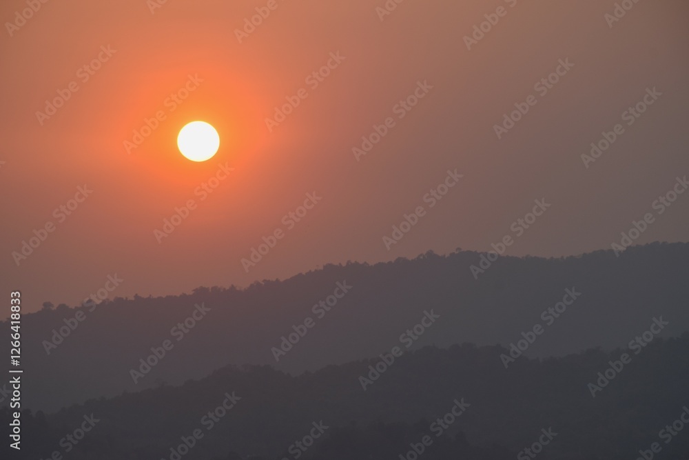 sunset into mountain at Khun Dan Prakarn Chon huge concrete dam in evening on Thailand sunset into mountain at Khun Dan Prakarn Chon huge concrete dam in evening on Thailand