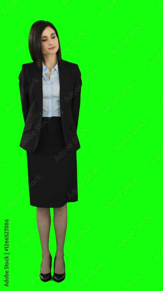Unsmiling businesswoman pointing at screen Unsmiling businesswoman pointing at screen