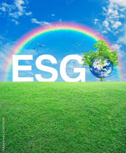 ESG white acronym with earth and tree on green grass field over rainbow and sky, Environmental Social Corporate Governance concept, Save the earth concept, Elements of this image furnished by NASA