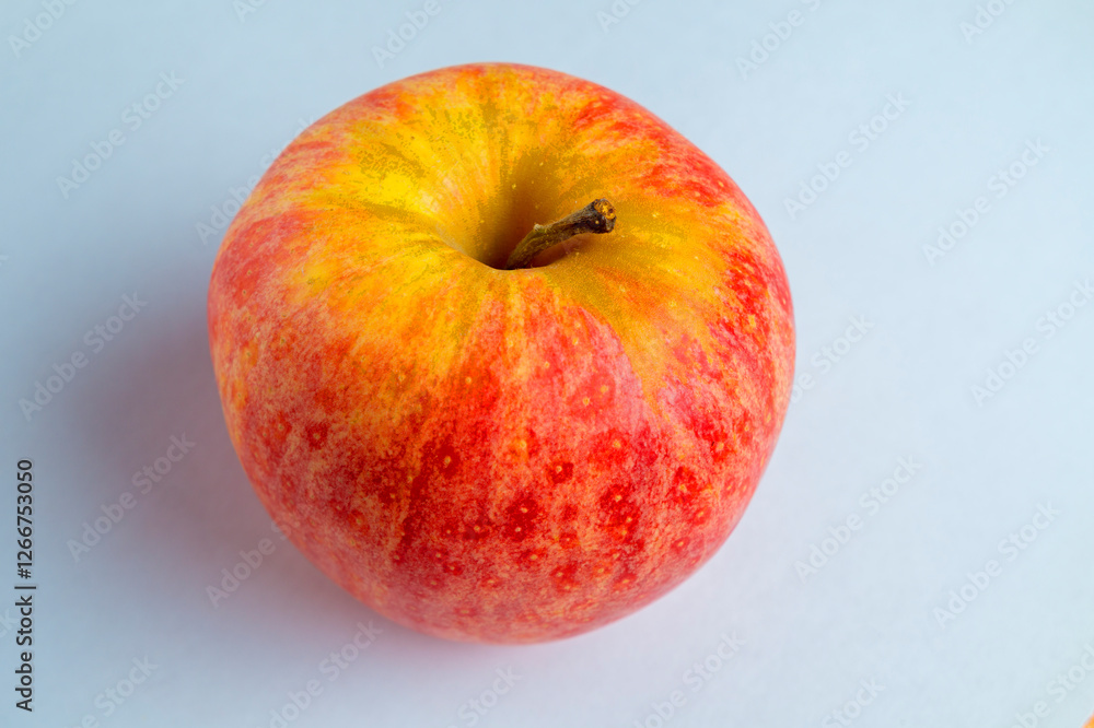 One ripe organic apple on a white background