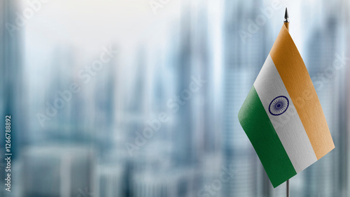 Small flags of the India on an abstract blurry background