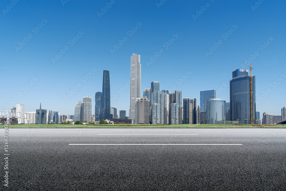 Modern Urban Skyline with Clear Blue Sky and Open Road Ahead Modern Urban Skyline with Clear Blue Sky and Open Road Ahead