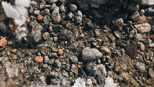 cold mountain waterstream among brown stones photo