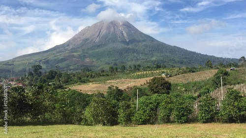 A breathtaking view of Mount Sinabung, an active volcano in North Sumatra, Indonesia, captured in stunning high resolution. Perfect for nature, travel, and documentary projects. photo