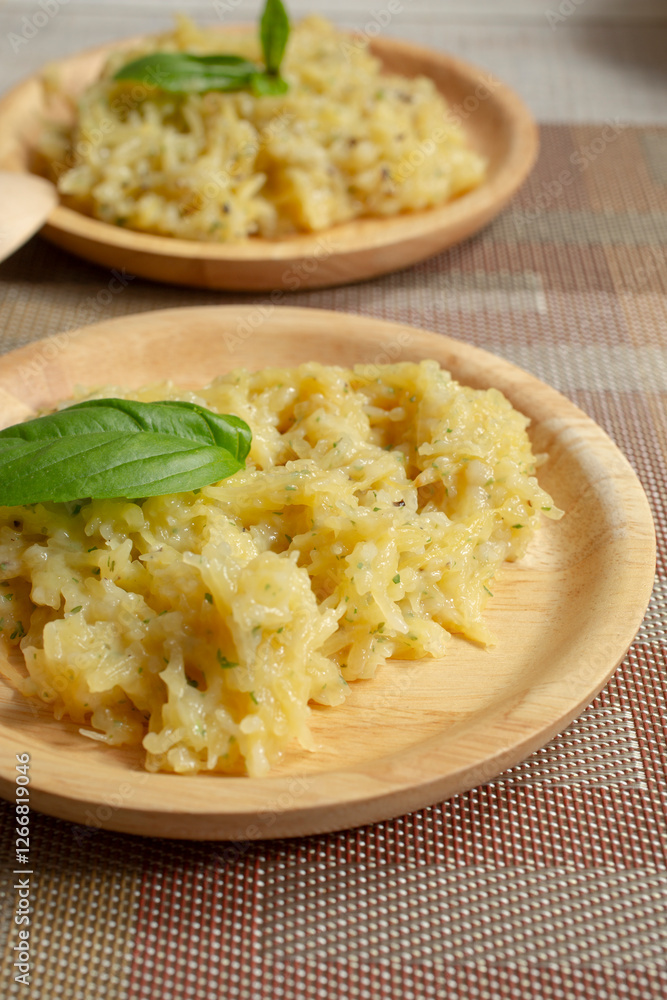 A view of some small plates of spaghetti squash Alfredo. A view of some small plates of spaghetti squash Alfredo.