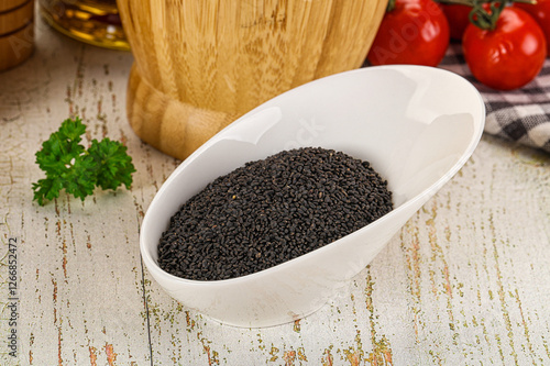 Black dry Nigella seeds in the bowl photo