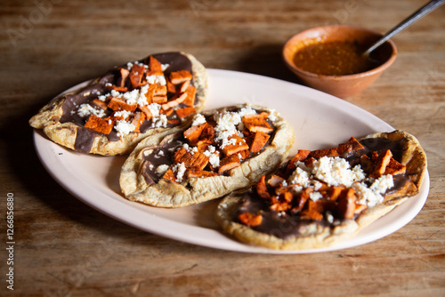 Memelas with beef jerky. Memela is an oval tortilla, made of corn dough and hand-made, traditional in the cuisine of Oaxaca in Mexico.