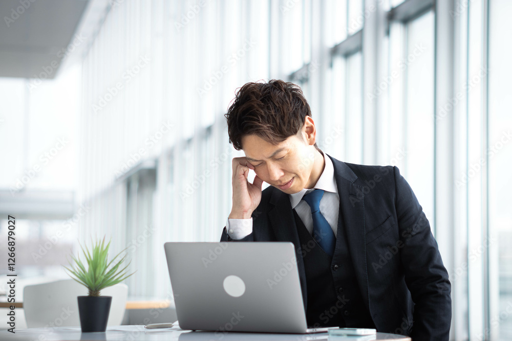 Headache, stress business man at laptop in office. Burnout, frustration, stress, irrition Headache, stress business man at laptop in office. Burnout, frustration, stress, irrition
