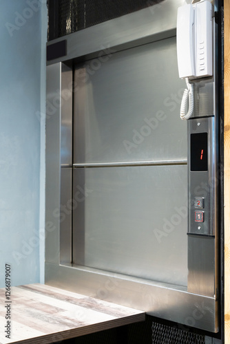 A food lift, also known as a dumbwaiter, service lift is a compact, mechanized lift designed specifically to transport food and sometimes other small items between different floors of a building.