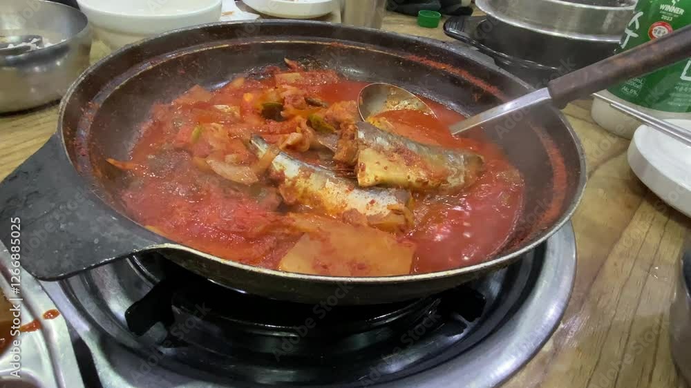 Mackerel stew boiling deliciously in a pot Mackerel stew boiling deliciously in a pot