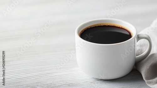 Cup of coffee on light wood table photo