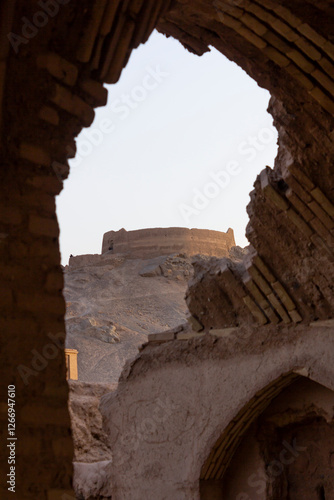 A wallpaper of the ruins of the towers of silence belonging to the Zoroastrian community in Yazd, Iran.  photo