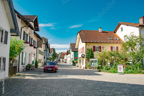Charming Bavarian street with traditional houses and cobblestone road in summer