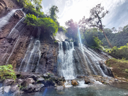 Tumpak Sewu Waterfall, Indonesia - Majestic Cascading Falls in Lush Nature