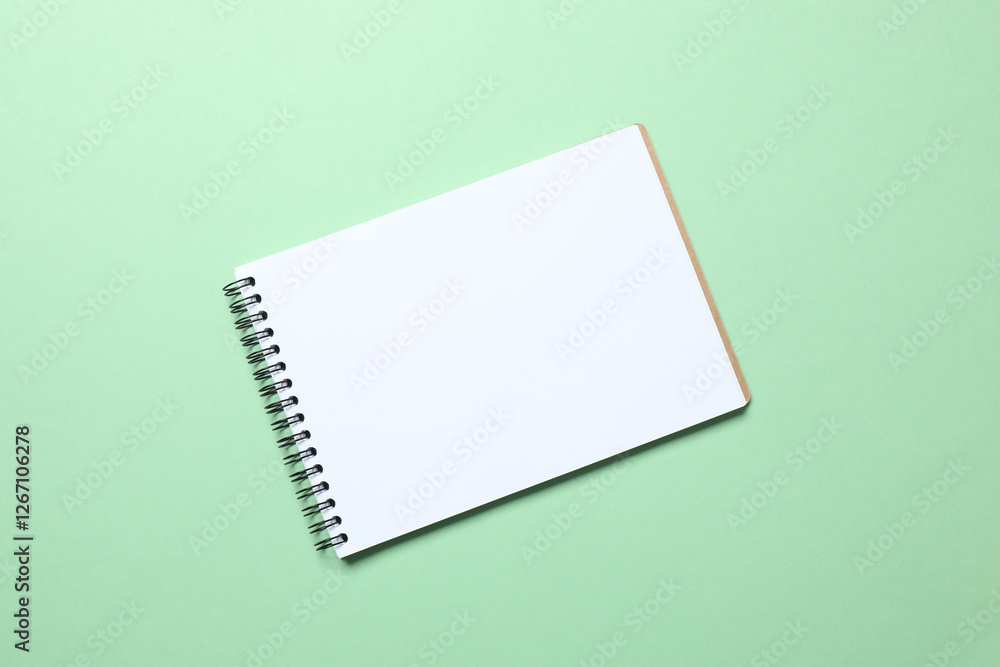 Flat lay with notebook on color background, top view Flat lay with notebook on color background, top view