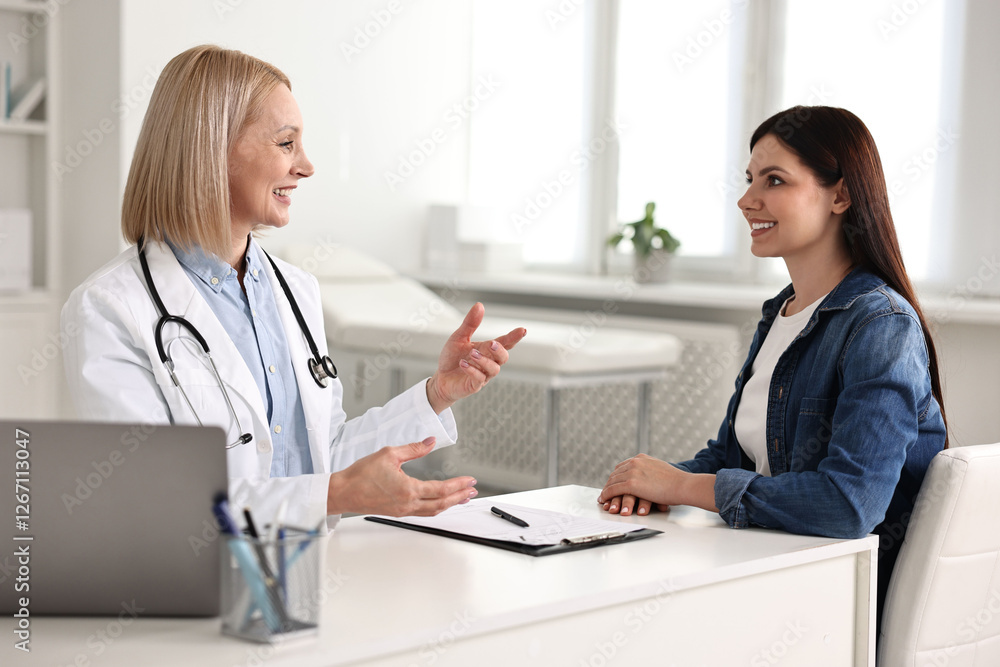 Woman having appointment with doctor in hospital Woman having appointment with doctor in hospital