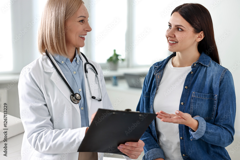 Woman having appointment with doctor in hospital Woman having appointment with doctor in hospital