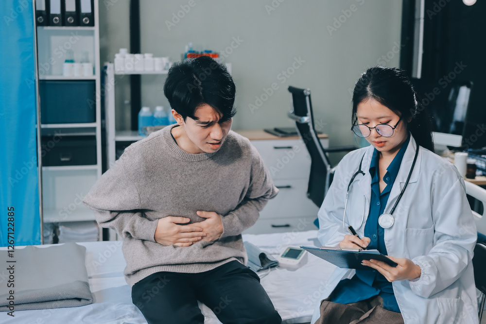 Female physician reads medical history while visiting her patient Female physician reads medical history while visiting her patient