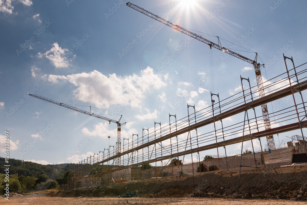 Public Building Under Construction – Raw Concrete Structure with Wooden Framework and Scaffolding Public Building Under Construction – Raw Concrete Structure with Wooden Framework and Scaffolding