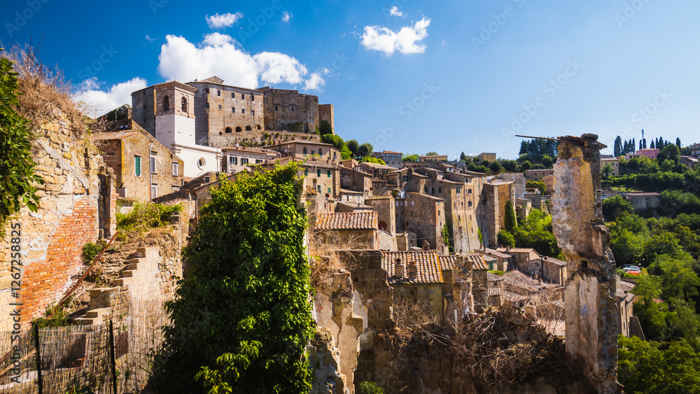 Charming view to the ancient medieval town of Sorano and its fortress with church tower and medieval terracotta houses in Tuscany, Italy evokes beautiful destination for summer italian vacation. Charming view to the ancient medieval town of Sorano and its fortress with church tower and medieval terracotta houses in Tuscany, Italy evokes beautiful destination for summer italian vacation.