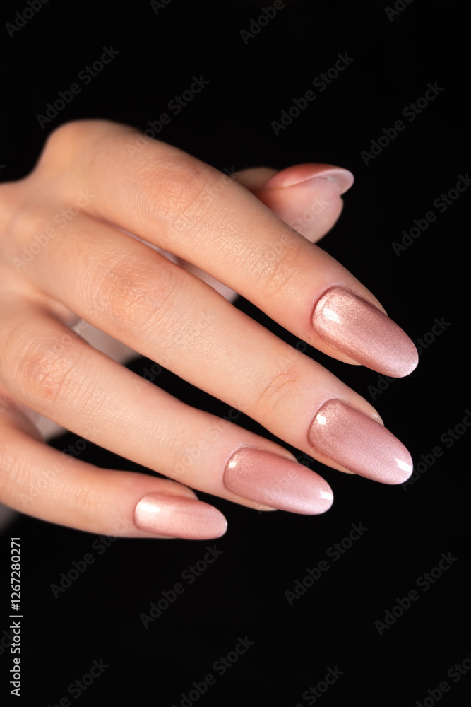 Shiny peach-colored magnetic manicure with a soft metallic sheen smoothly transitions, creating a three-dimensional illusion. Shiny peach-colored magnetic manicure with a soft metallic sheen smoothly transitions, creating a three-dimensional illusion.