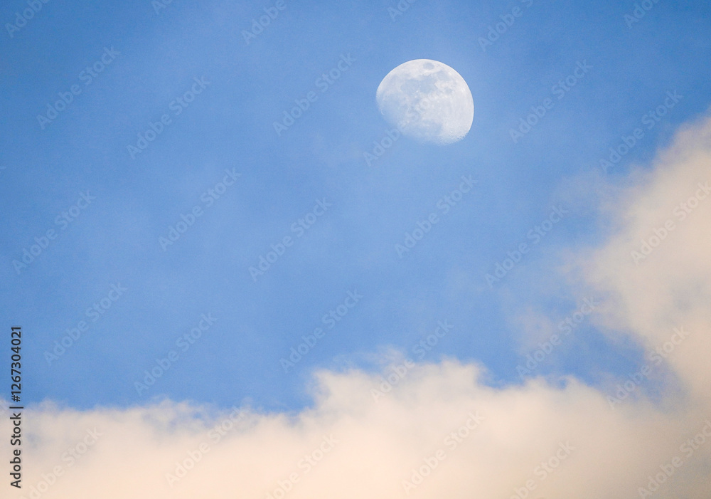 The moon in the daytime sky before dusk The moon in the daytime sky before dusk