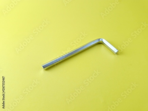 Silver hexagonal keys on a yellow background