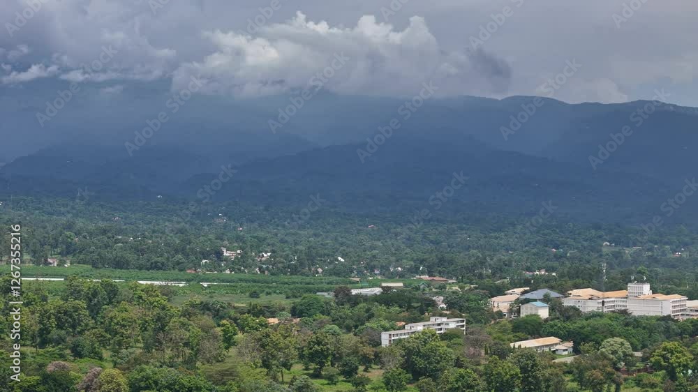 Mountain range with a town in the distance Mountain range with a town in the distance