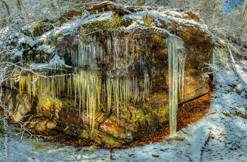 Dahner Felsenland after rainy days frost comes and with it many icicles that grow on the various rocks, fascinating shapes and structures photo