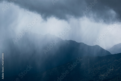 Canvas Print rainfall above the mountains