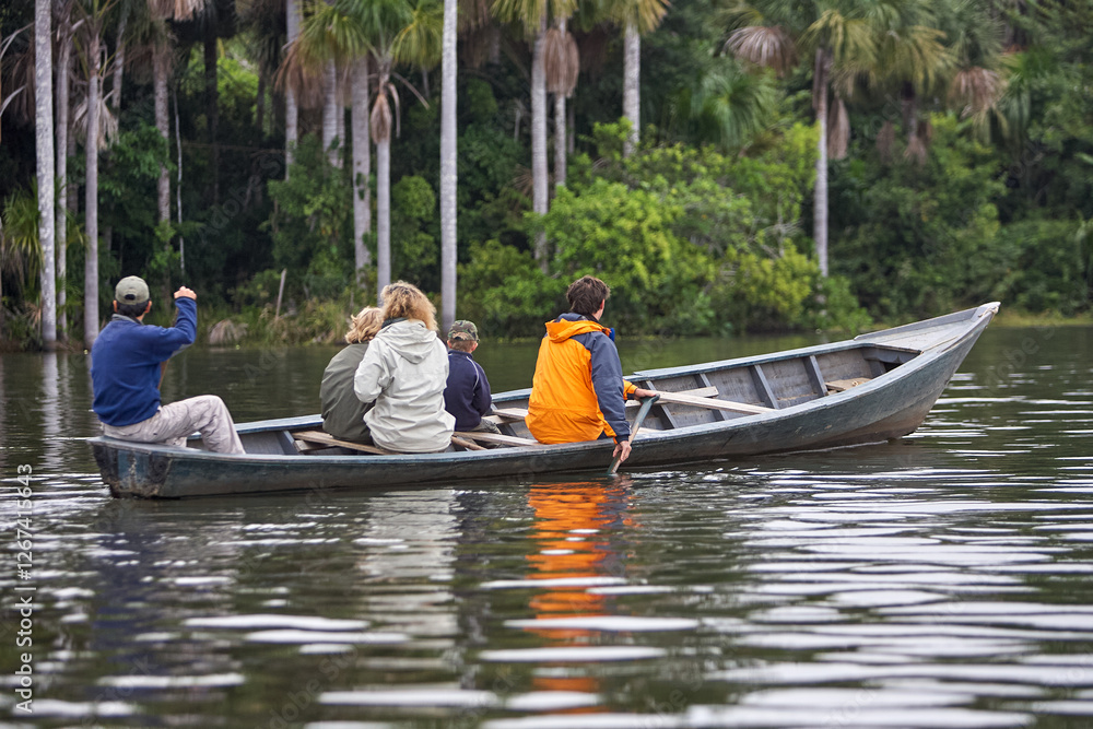Fototapeta premium Lake Sandoval is a beautiful oxbow lake located in the Tambopata National Reserve in the Madre de Dios region of southeastern Peru. It's a popular destination for ecotourism and wildlife enthusiasts 