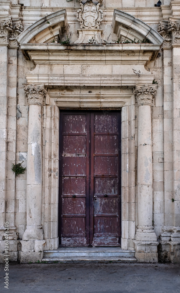 Architecture of the entrance into the old church in Sicily Architecture of the entrance into the old church in Sicily