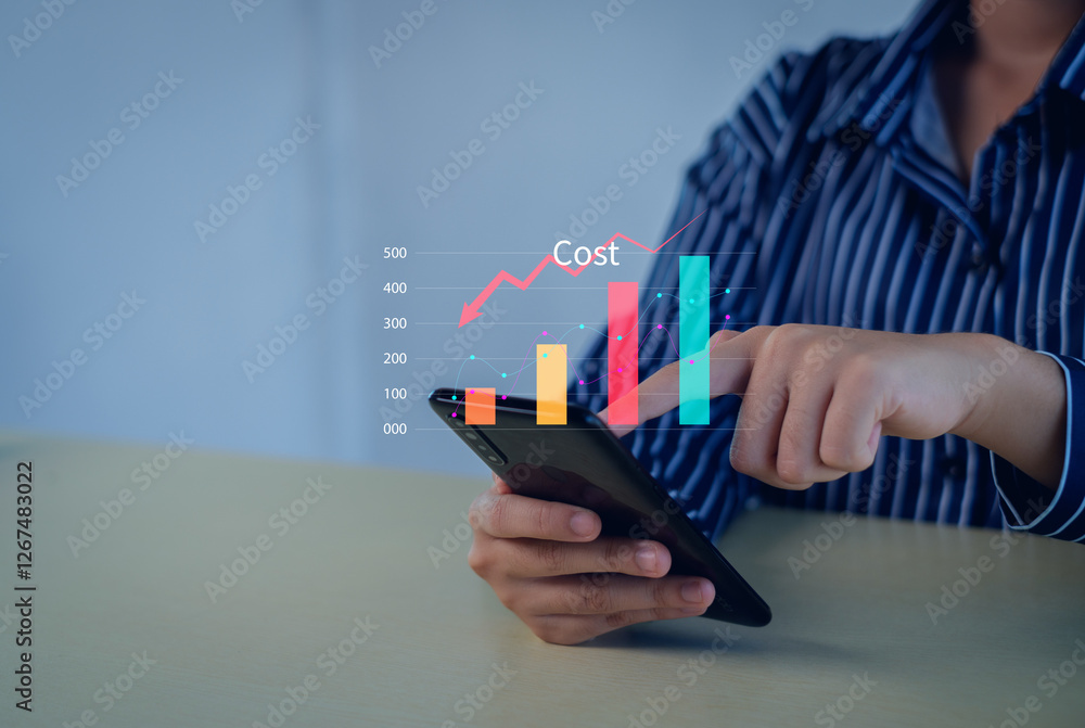 Business pointing down arrow of the graph with cost reduction business finance on virtual screen. Cost reduction concept. Business pointing down arrow of the graph with cost reduction business finance on virtual screen. Cost reduction concept.