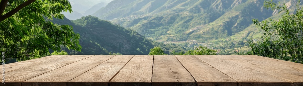 Scenic View of Mountains with Wooden Table Top in Foreground Against Lush Green Landscape under Blue Sky Scenic View of Mountains with Wooden Table Top in Foreground Against Lush Green Landscape under Blue Sky