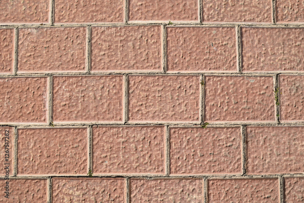 Naklejka premium Foto de losa de cemento color terracota, simulando ladrillo para usar como fondo de escritorio.