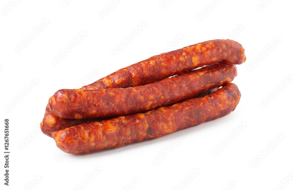 Many thin dry cured sausages isolated on white Many thin dry cured sausages isolated on white