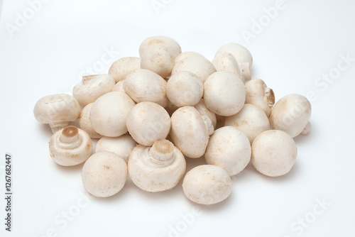 Fresh champignon mushrooms on a white background