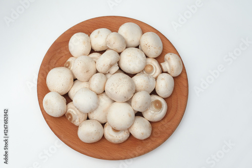 Whole Mushrooms on a Wooden Plate – Top View